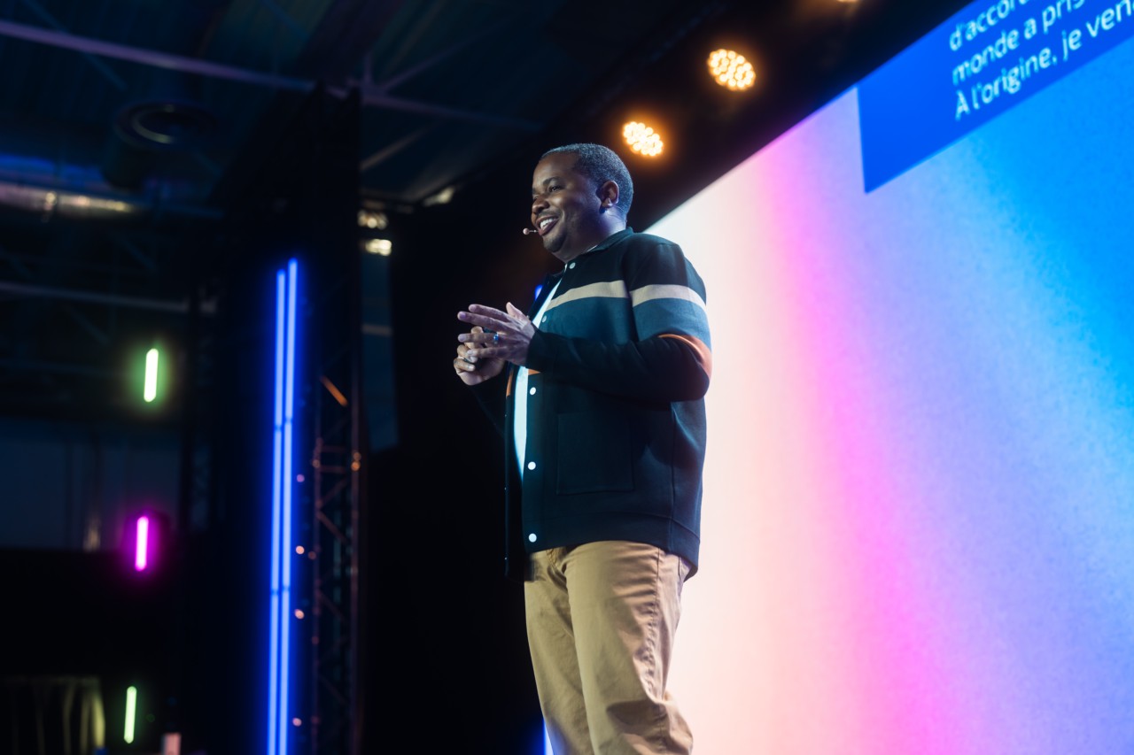 SYLVAIN s﻿trategy partner Aaron Powers shown speaking on stage at Decathlon’s Festival of Innovation Exchange