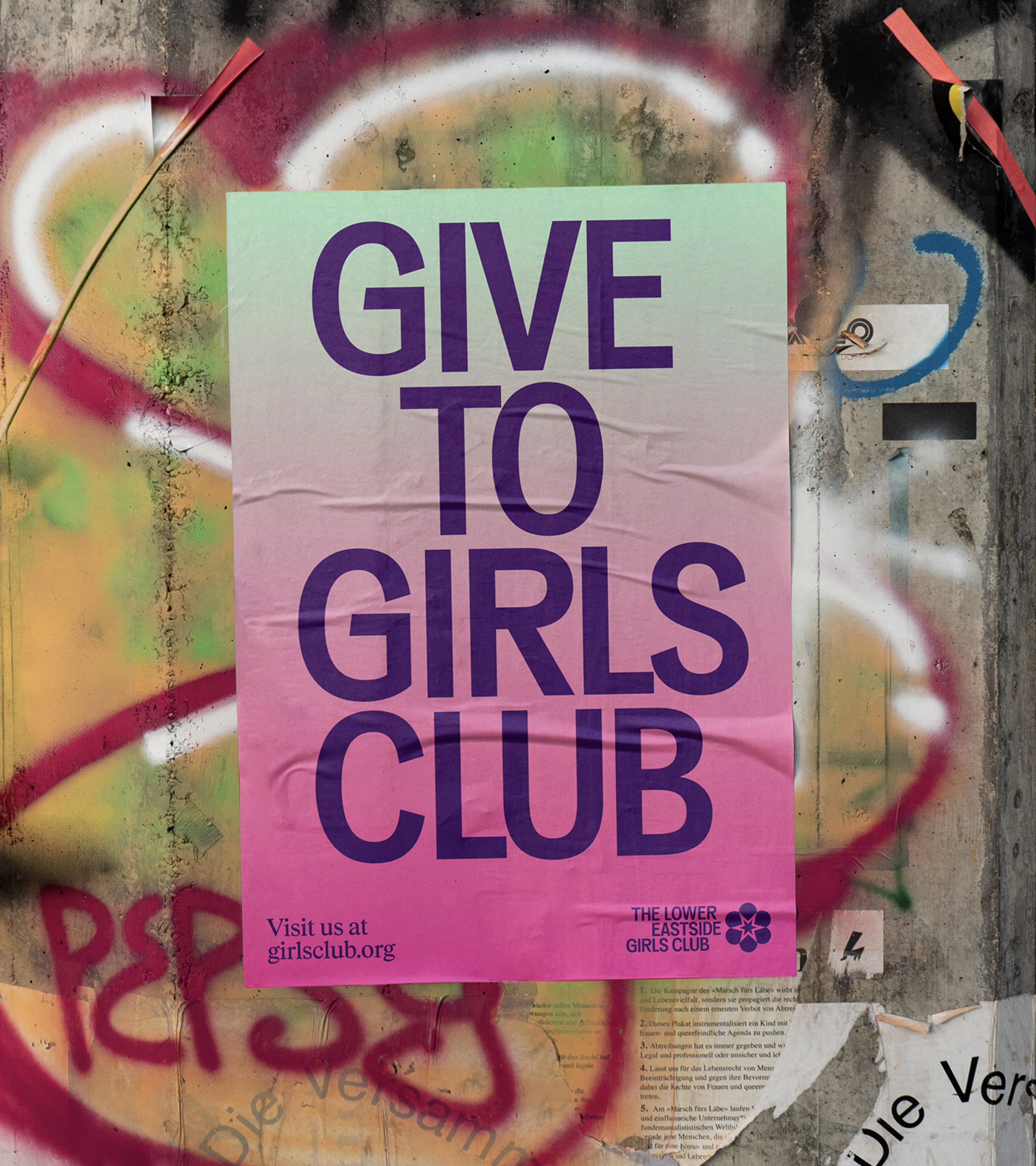 s﻿ingle wheatpaste poster that says “give to girls club”