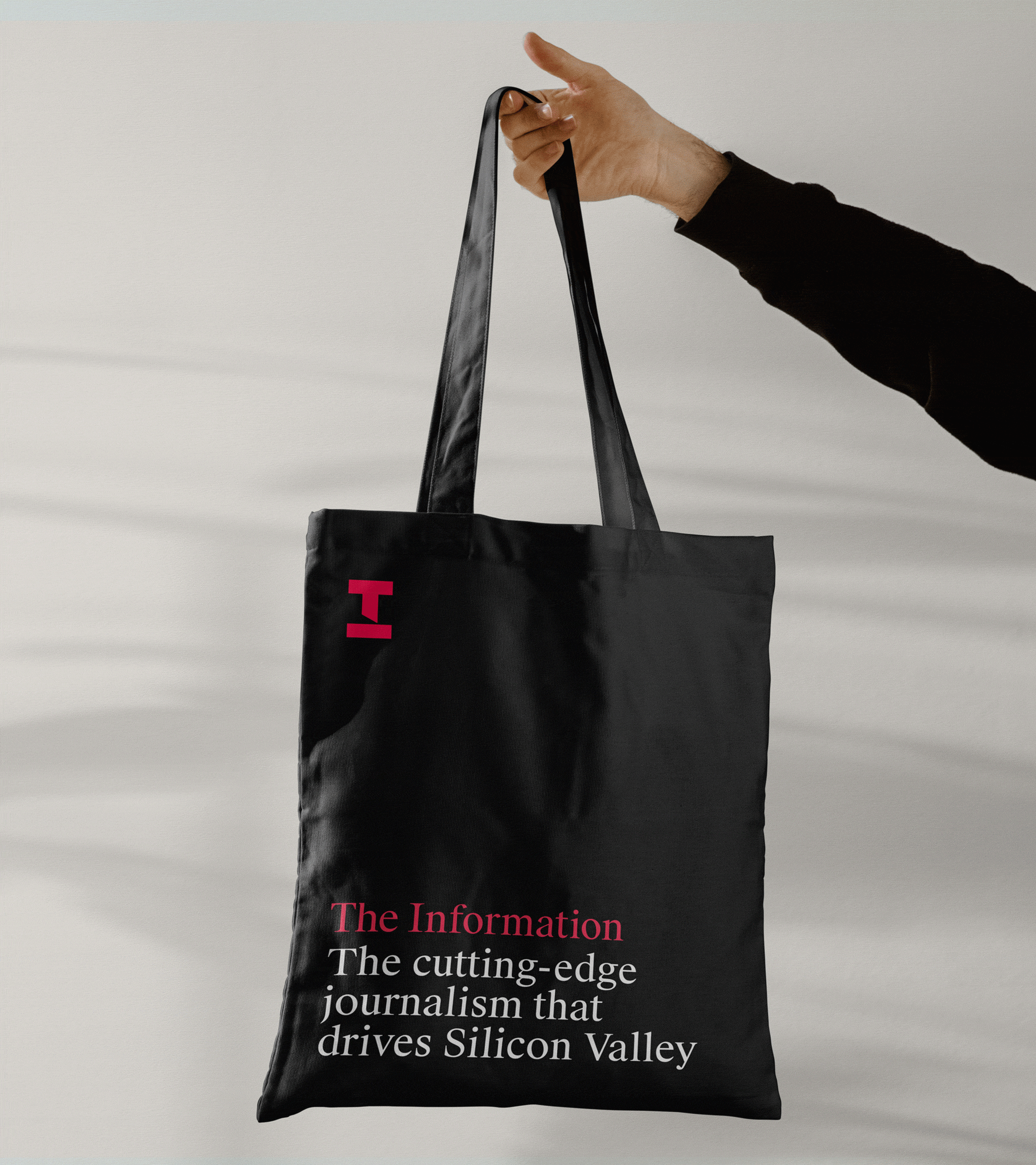 GIF of The Information merch, including tote, pencils and a notebook